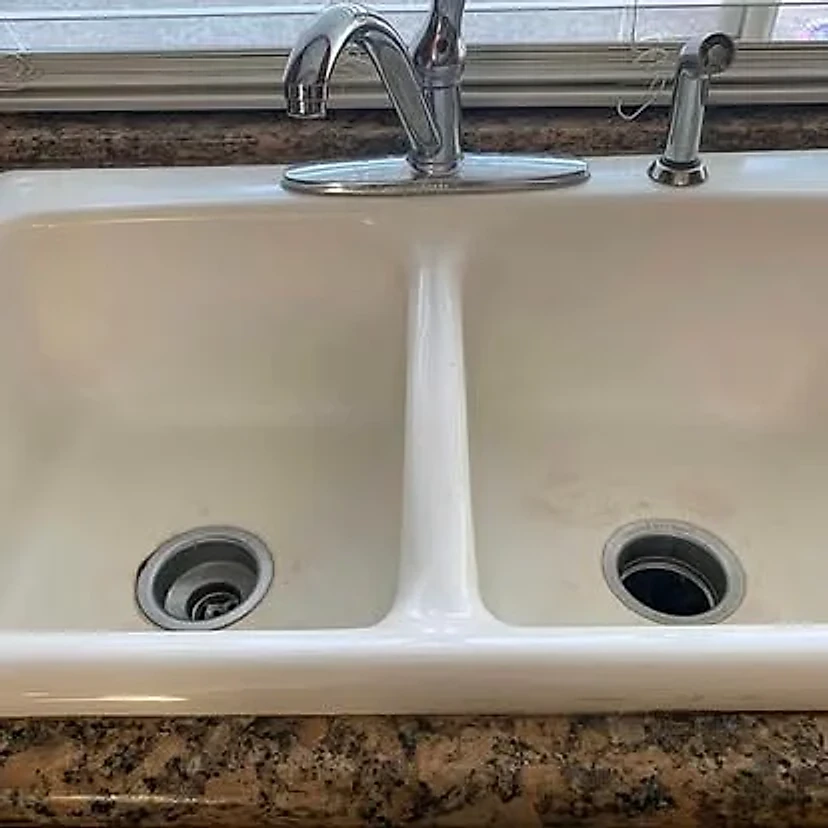 White double-basin kitchen sink before replacement
