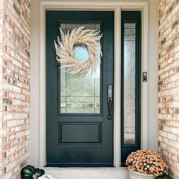Handyman fitting hardware to a residential entry door